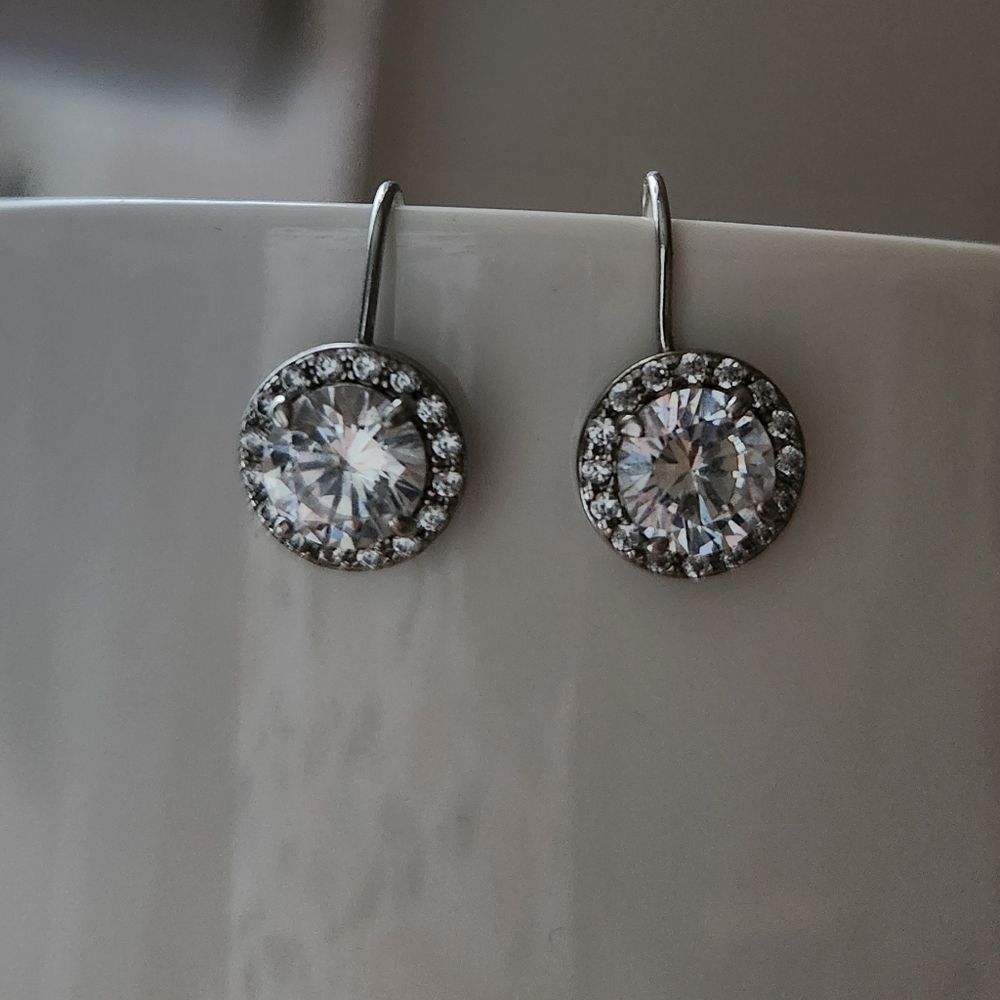 Beautiful 925 sterling silver earrings with lab made white sapphire.